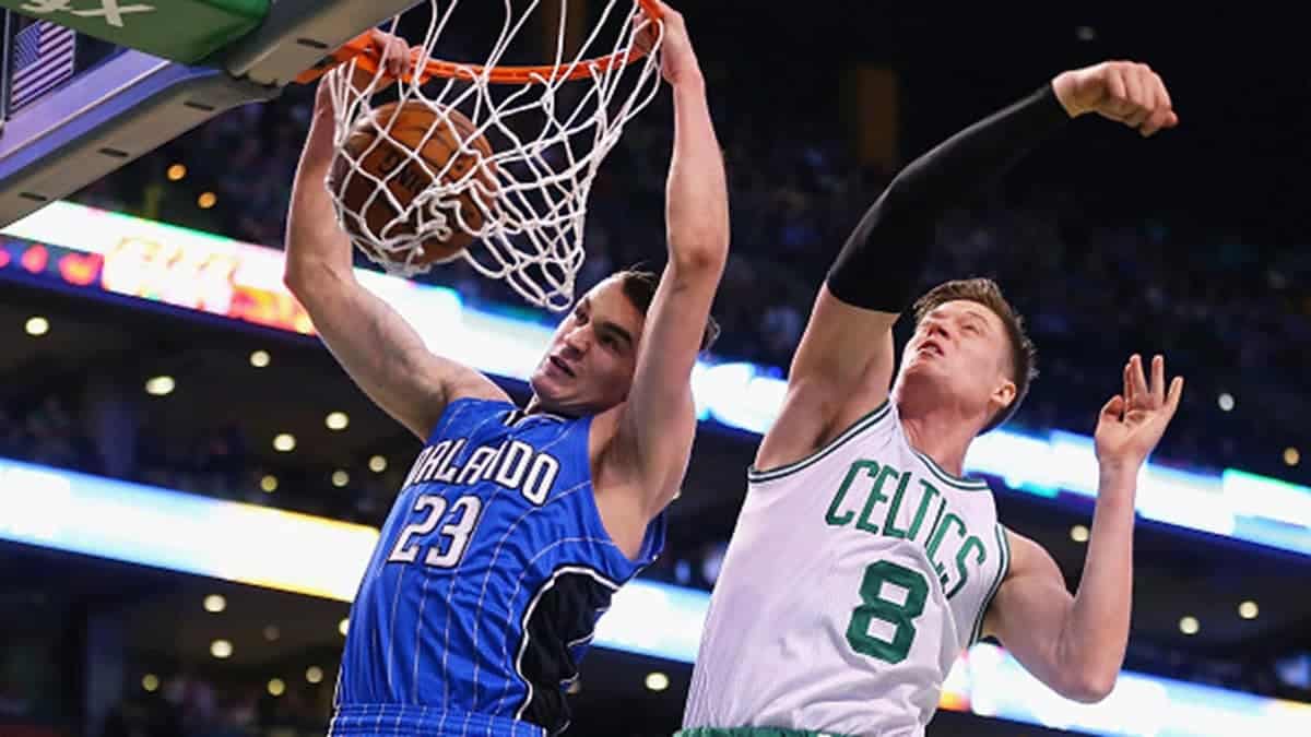 Jonas Jerebko of the Boston Celtics defends Mario Hezonja of the Orlando Magic during an NBA game.