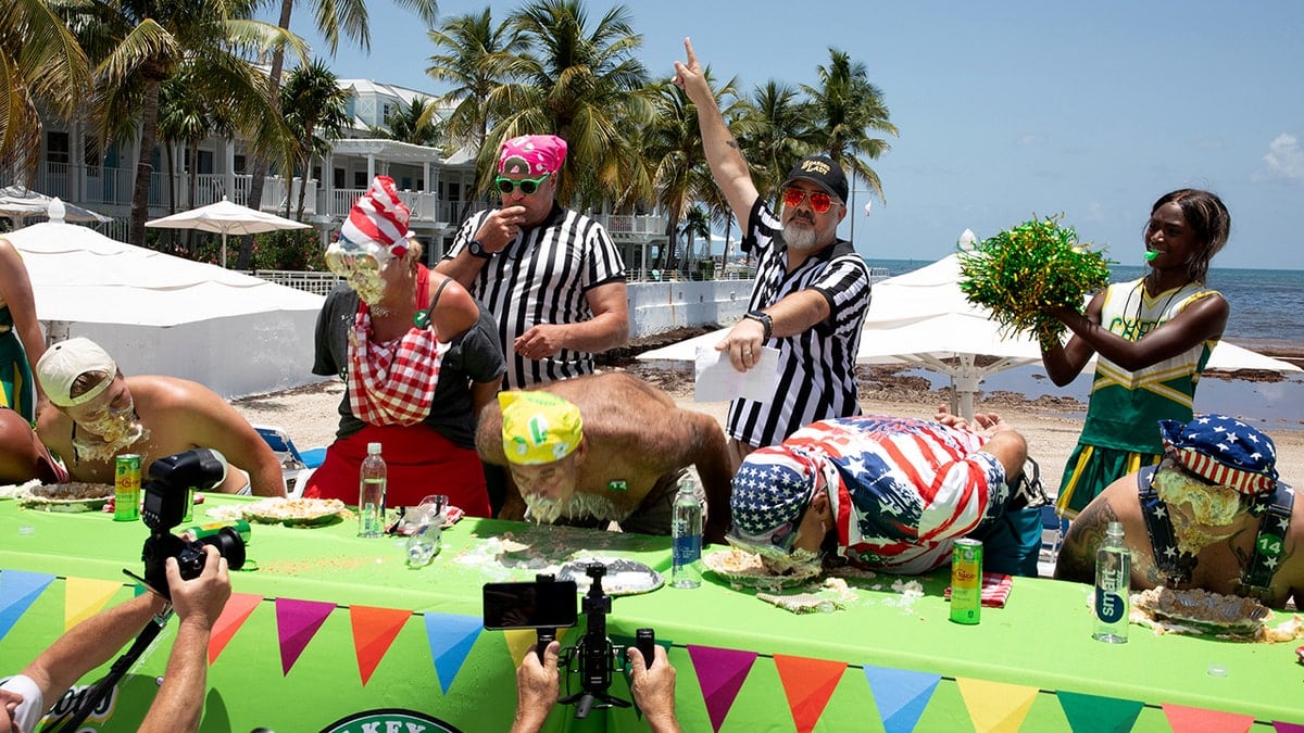 A referee points to the winner of the 2026 World Famous Key Lime Pie Eating Championship.
