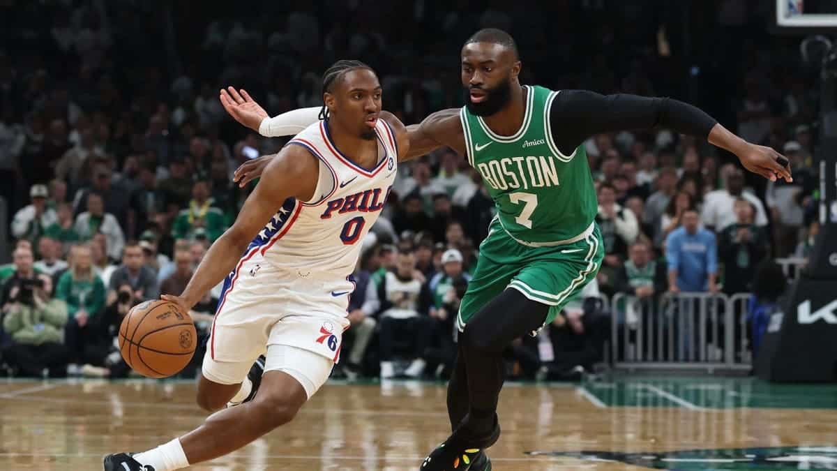 Philadelphia 76ers SG Tyrese Maxey drives past former Boston Celtics wing Jaylen Brown during Game 7 of the first round of the 2026 NBA Playoffs at TD Garden.