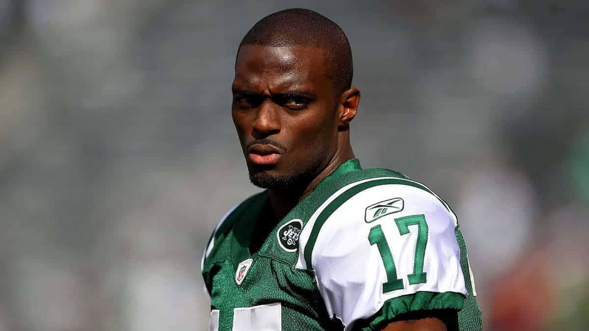 Plaxico Burress, wearing Jets number 17, warms up before a game at MetLife Stadium.