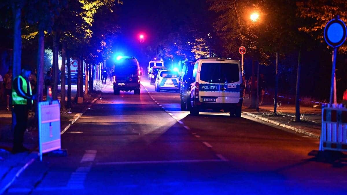 Police officers stand on scene in Berlin following Christopher Street Day cancellation.