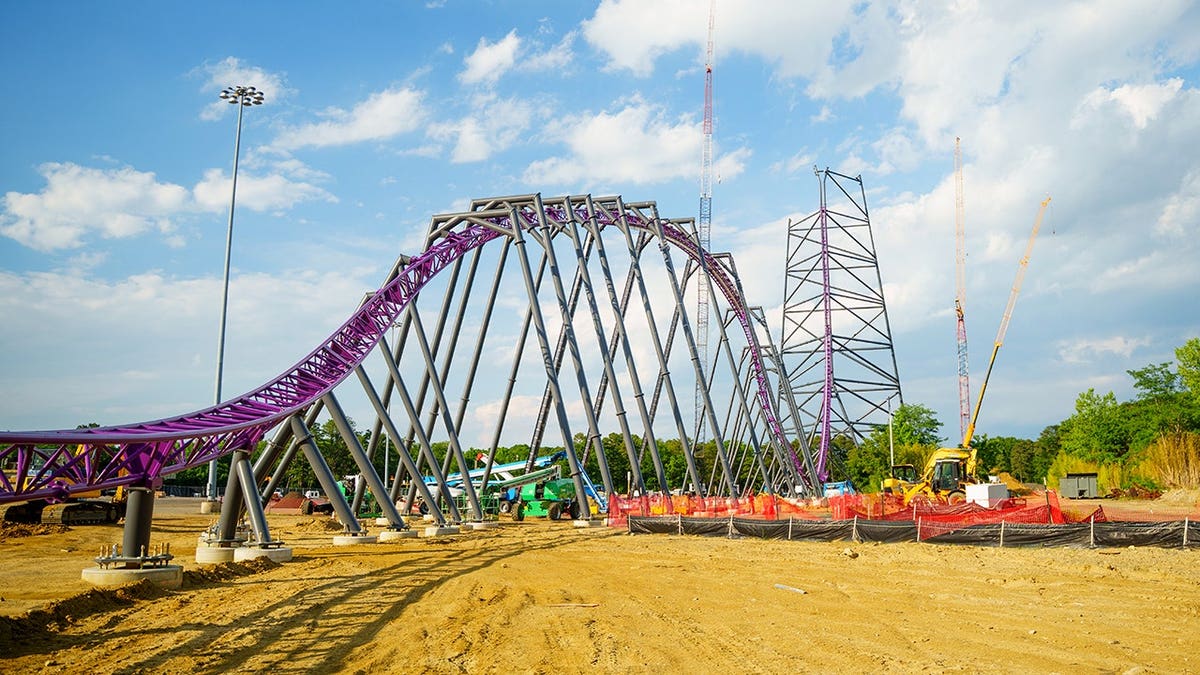 Project Purple roller coaster under construction at Six Flags Great Adventure, with the steel structure rising more than 320 feet.