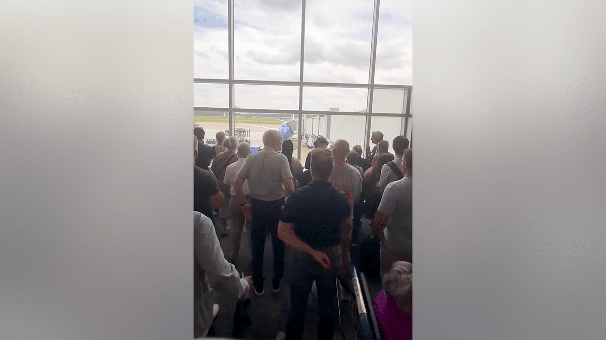 Travelers stand in silent tribute as fallen US service member returns home at RDU Airport