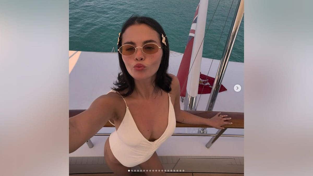Selena Gomez on a yacht in a white bikini in an Instagram post shared in July 2026.