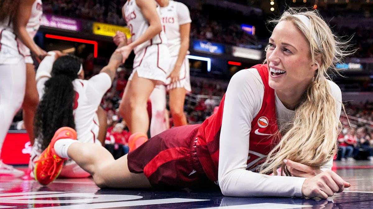 Sophie Cunningham smiles after falling on the court during an Indiana Fever game.