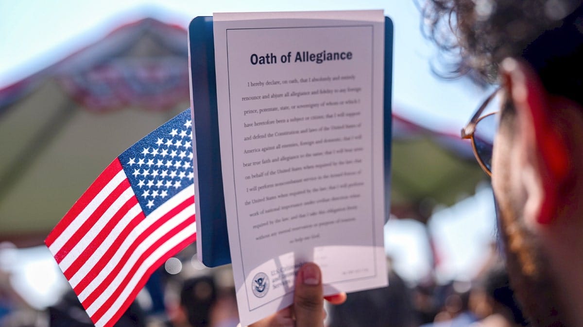 New citizen holding flag