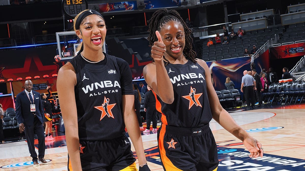 Angel Reese and Nneka Ogwumike smile before the WNBA All-Star Game in Indianapolis.