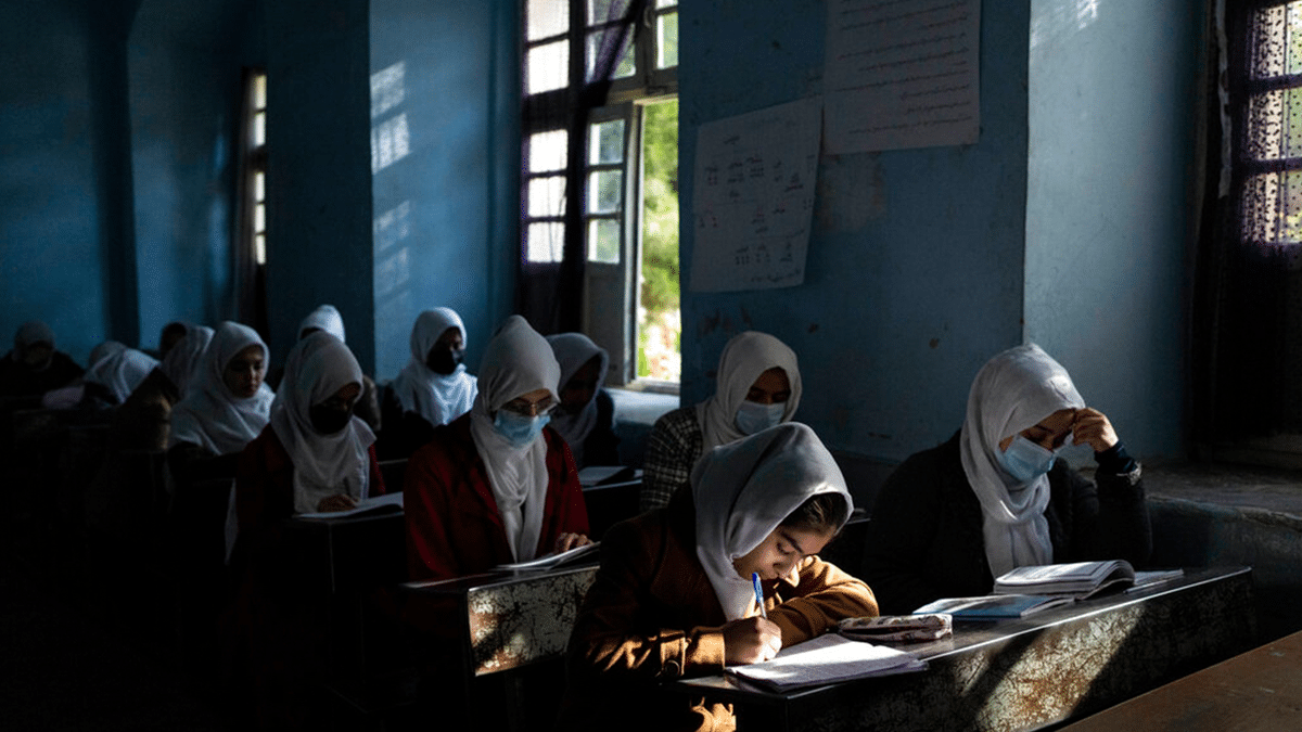 Afghan girls participate in a lesson at Tajrobawai Girls High School, in Herat, Afghanistan, Thursday, Nov. 25, 2021. Since the chaotic Taliban takeover of Kabul on Aug. 15, an already war-devastated economy once kept alive by international donations alone is now on the verge of collapse. The World Health Organization is warning of millions of children suffering malnutrition, and the U.N. says 97% of Afghans will soon be living below the poverty line. (AP Photo/Petros Giannakouris)