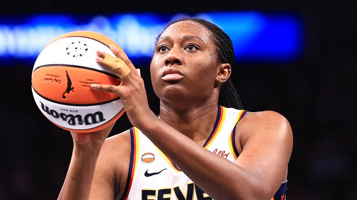 Aliyah Boston shoots a free throw during a game.