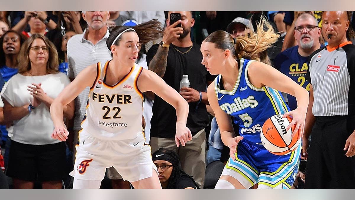 Paige Bueckers drives to the basket during a WNBA game