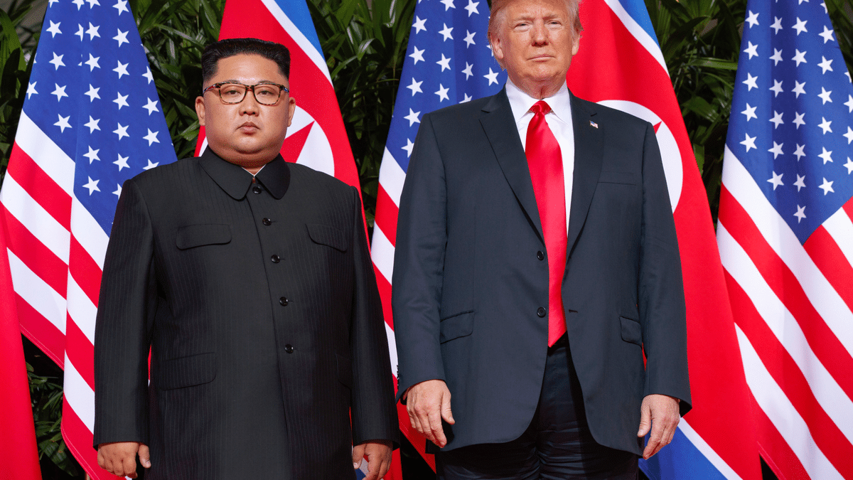 President Donald Trump poses with North Korean leader Kim Jong Un