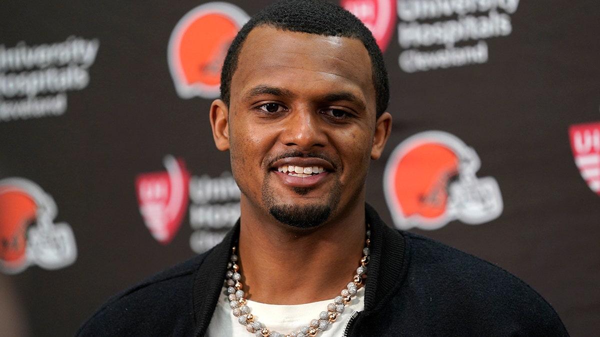 Deshaun Watson talks to reporters