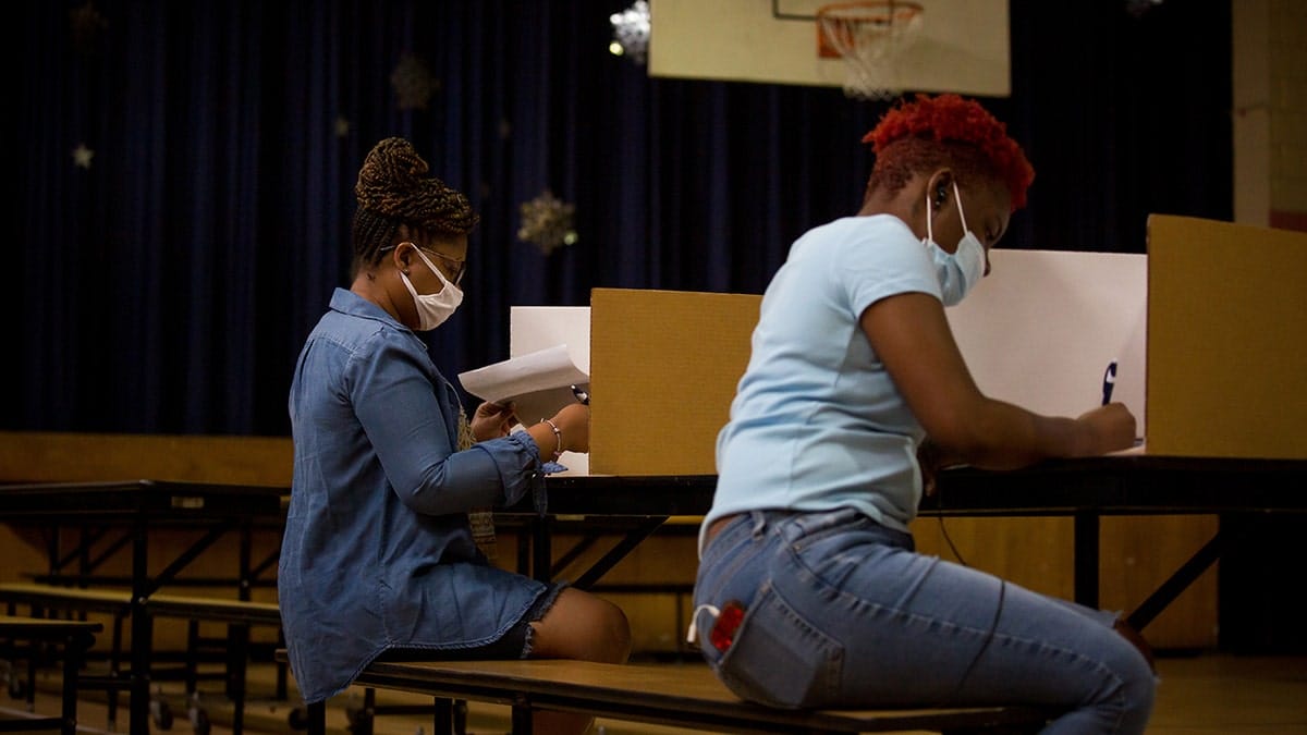 Voters cast ballots at a polling location in Newark, New Jersey, U.S., on Tuesday, July 7, 2020. The primaries Tuesday feature party-switching Representative Jeff Van Drew seeking re-election as a Republican and will set the matchups in three other districts Democrats captured from Republicans in 2018. Photographer: Michael Nagle/Bloomberg via Getty Images