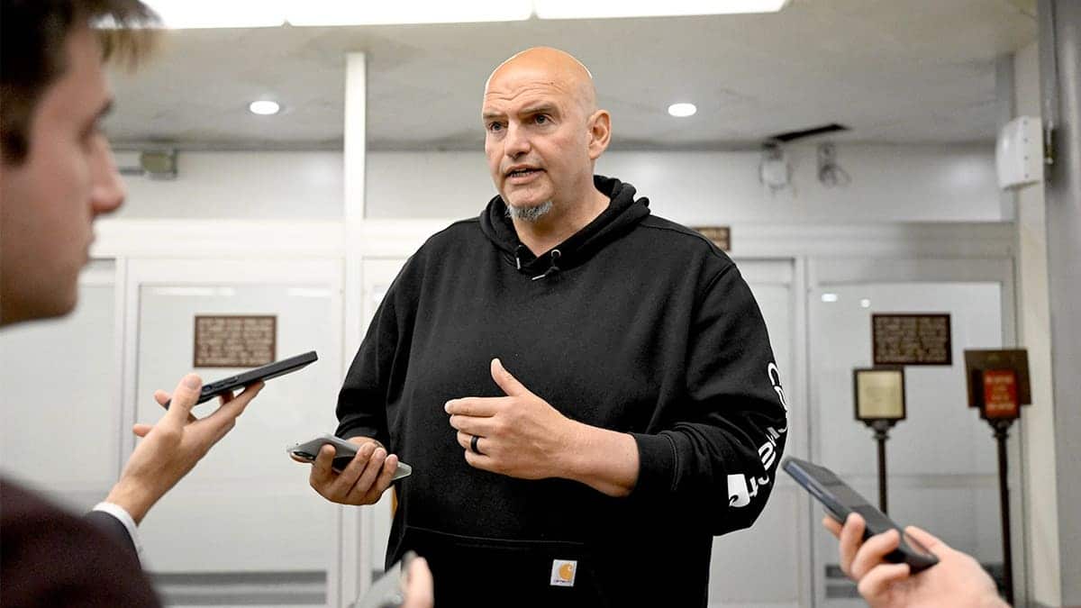 John Fetterman speaks with reporters