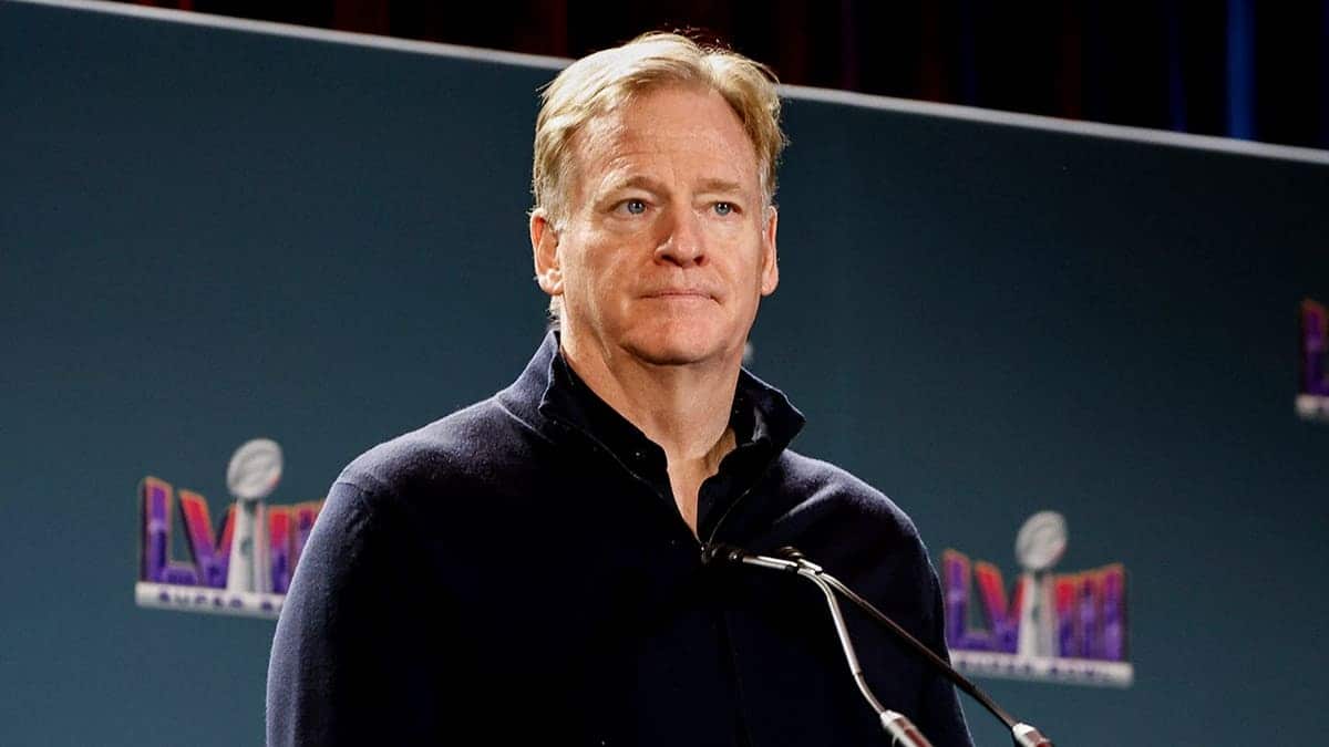 NFL Commissioner Roger Goodell stands at the podium during a press conference