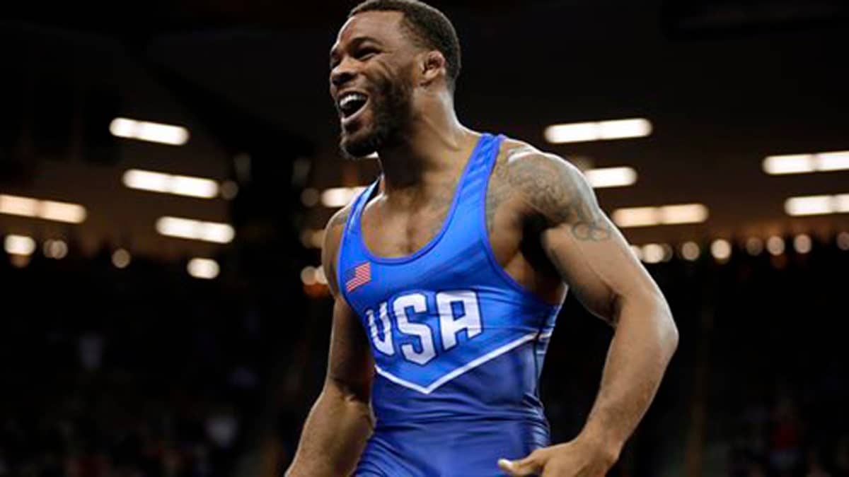 FILE - In this April 10, 2016, Jordan Burroughs celebrates after beating Andrew Howe in their 75-kilogram freestyle finals match at the U.S. Olympic Wrestling team trials in Iowa City, Iowa. Burroughs burst onto the international scene in 2011, winning a world title just six months after leaving the University of Nebraska. (AP Photo/Charlie Neibergall, File)
