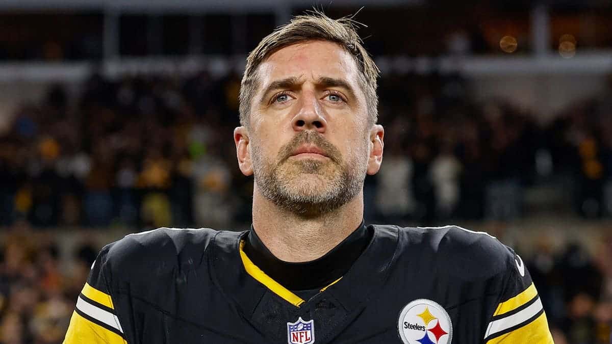 Aaron Rodgers stands for the national anthem at Acrisure Stadium.