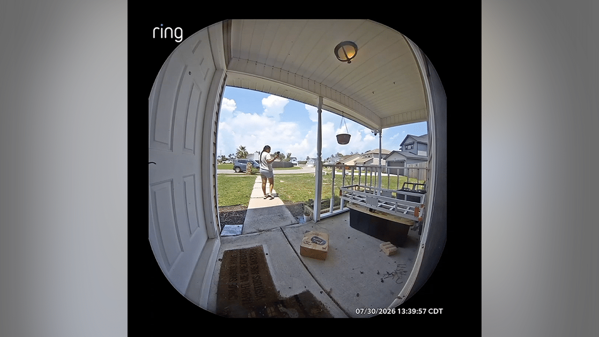 Doorbell camera captures a delivery driver after tossing a package onto the concrete porch of a Florida home before taking a proof-of-delivery photo