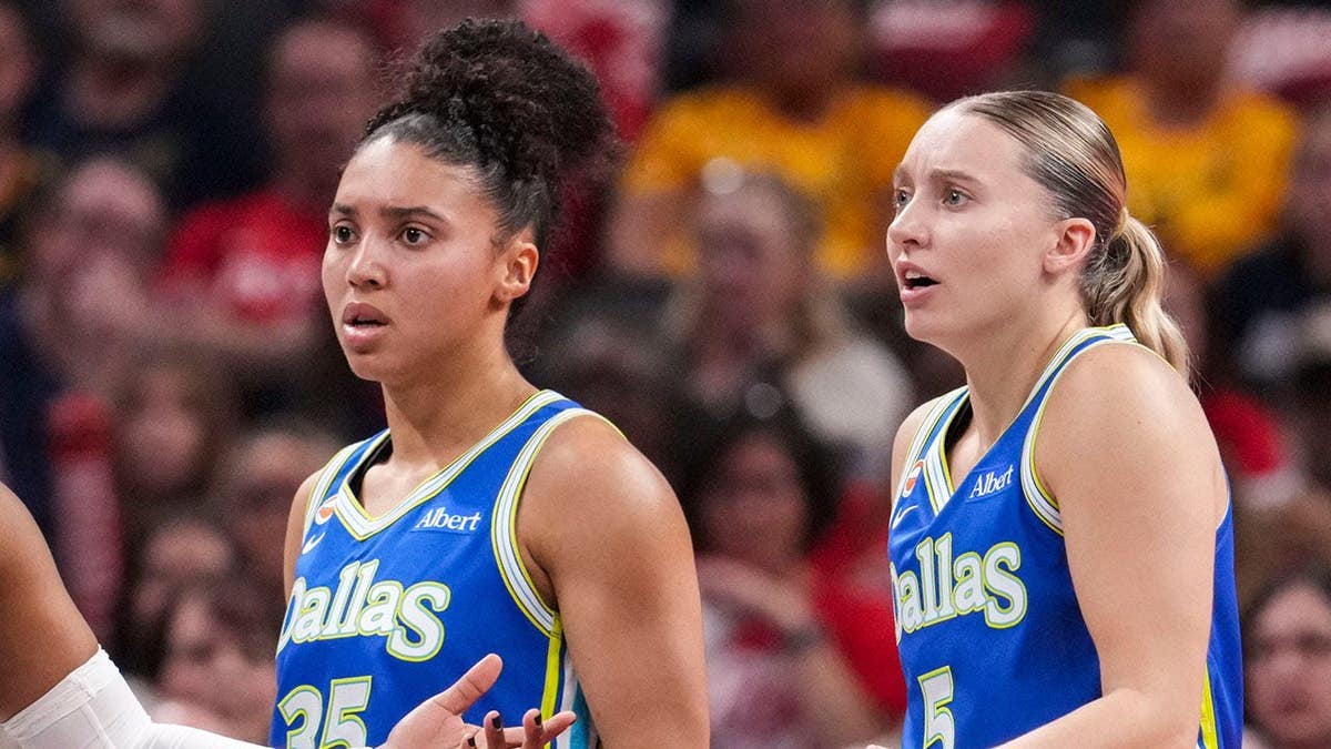 Dallas Wings guards Arike Ogunbowale, Azzi Fudd, and Paige Bueckers reacting during a basketball game.