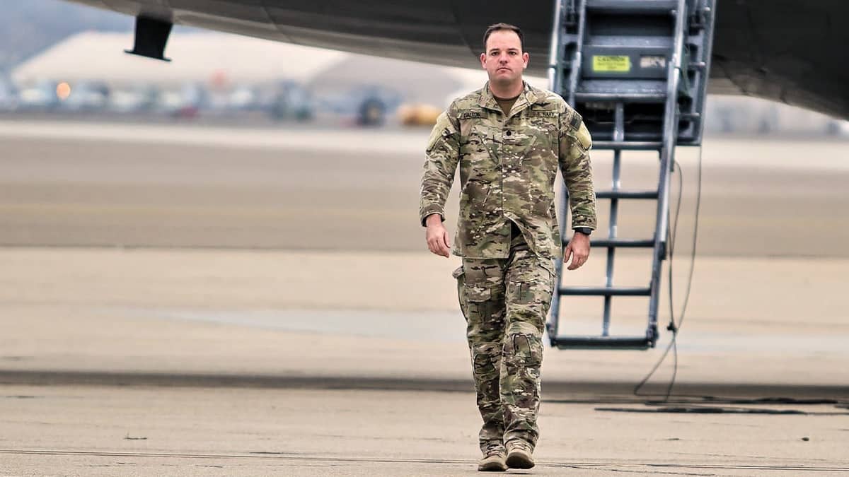 Bale Dalton walks from a military aircraft
