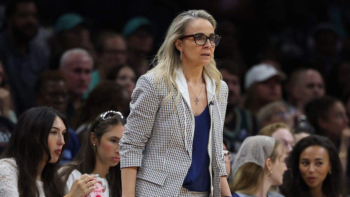 Becky Hammon, head coach of the Las Vegas Aces, looks on during a game.