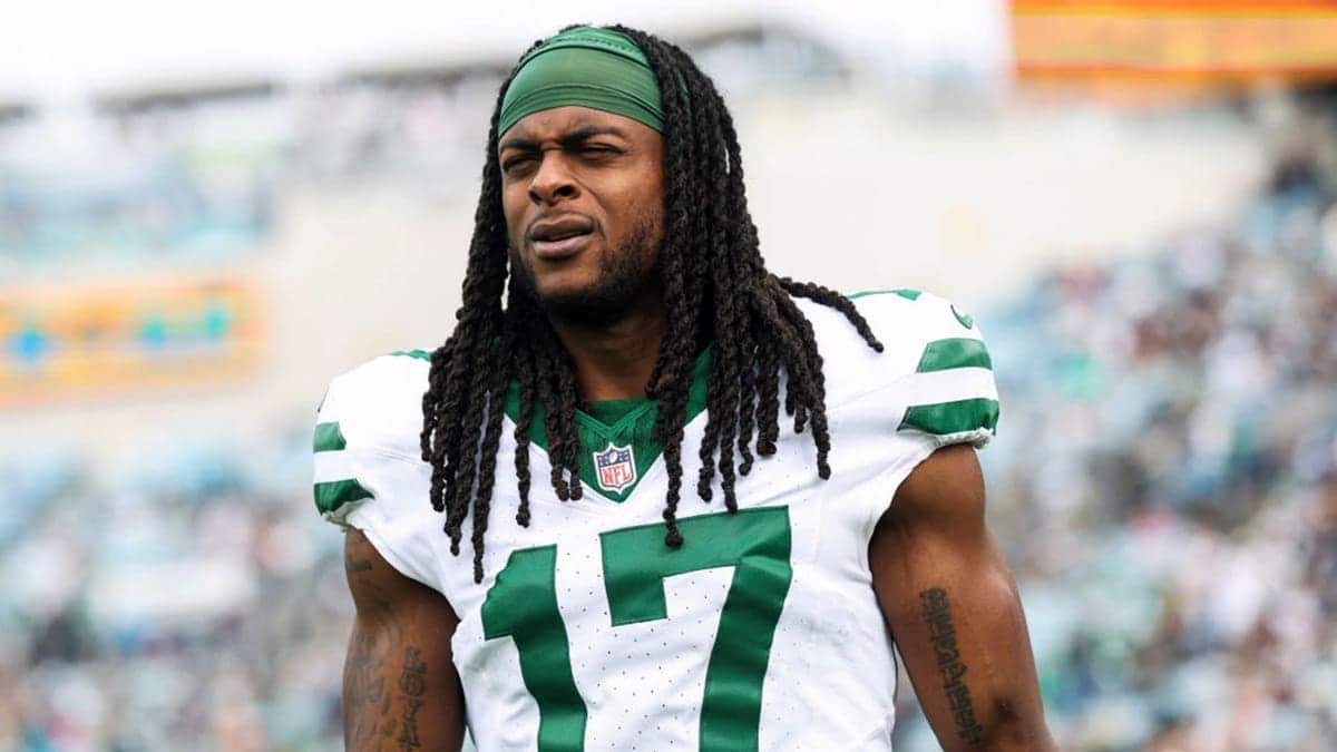 Davante Adams of the New York Jets looks on from the sideline.