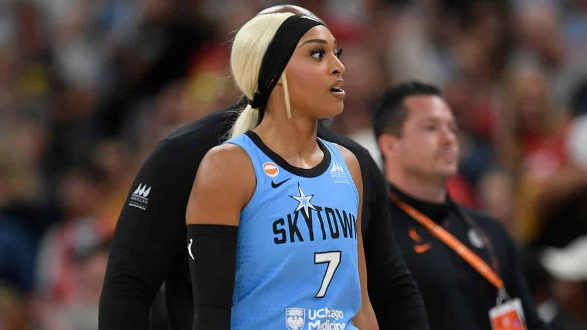 DiJonai Carrington walks off the court after being ejected from a WNBA game.