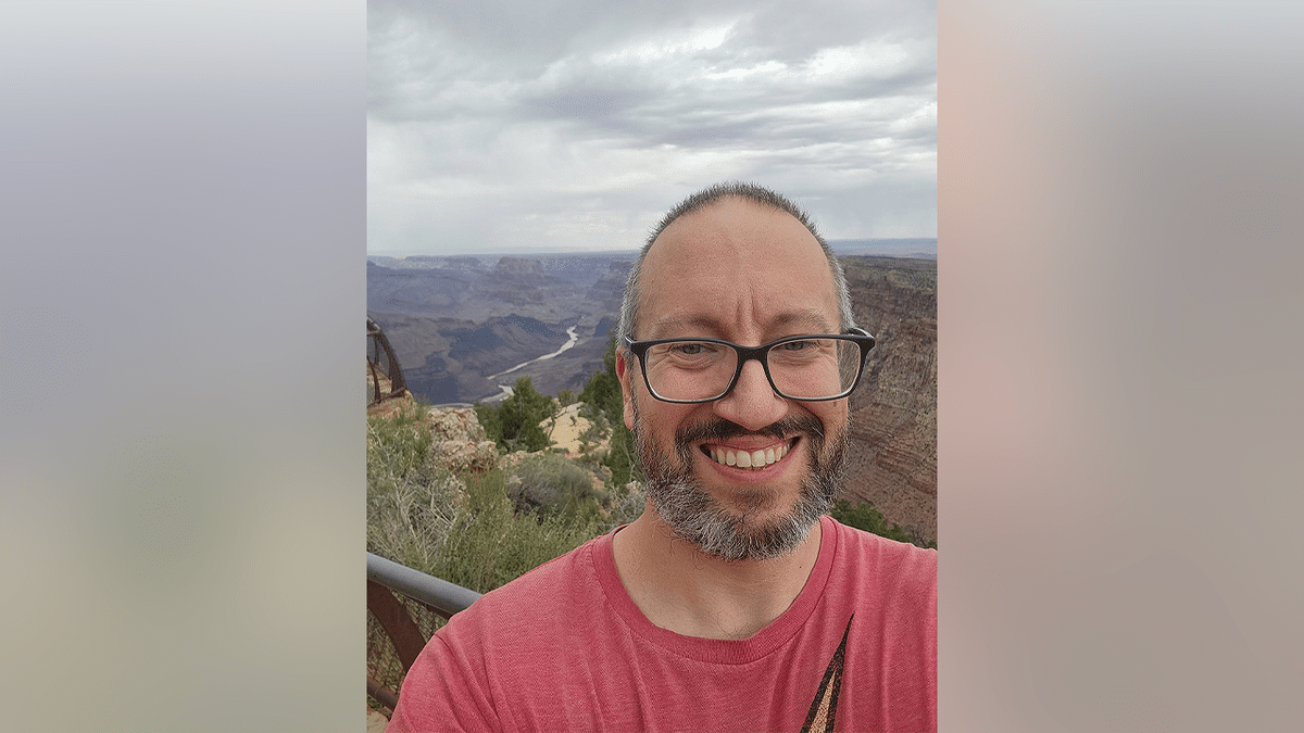 Texas chiropractor Dr. John Giusti takes a selfie overlooking the Grand Canyon during a hiking trip