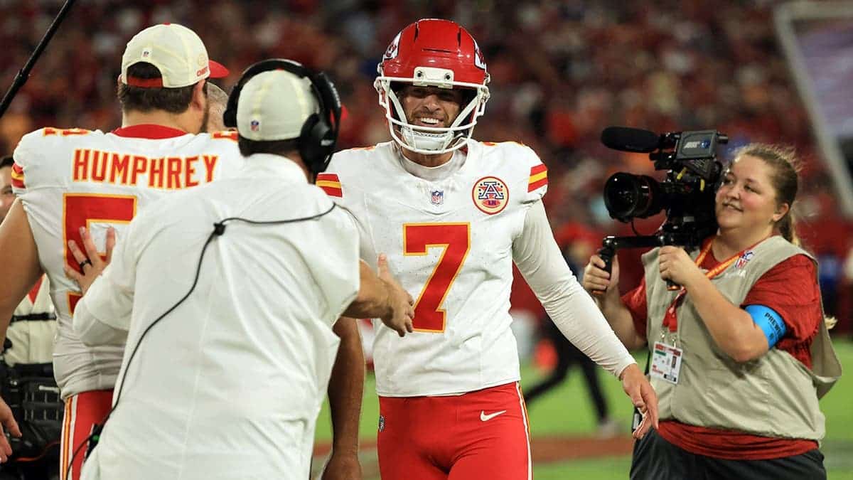 Harrison Butker celebrates after making a 69-yard field goal at Raymond James Stadium.