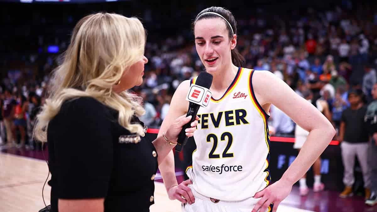 Holly Rowe interviews Caitlin Clark #22 after the game.