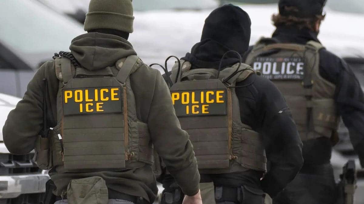 ICE agent walks in uniform