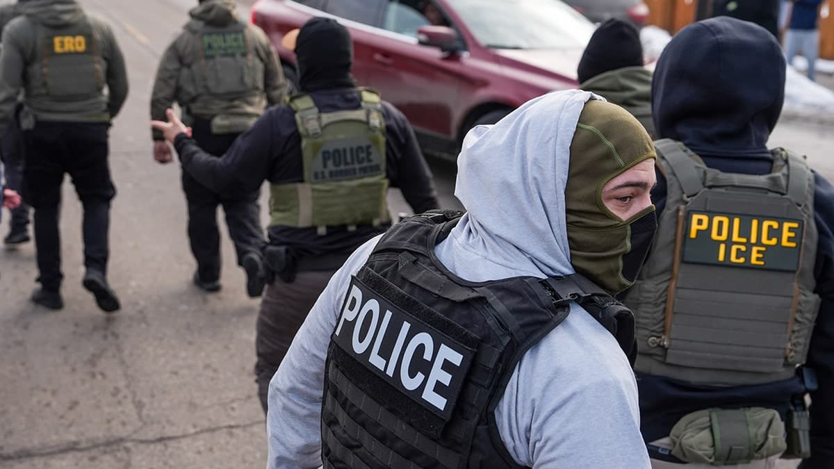 Federal agents walking during operation