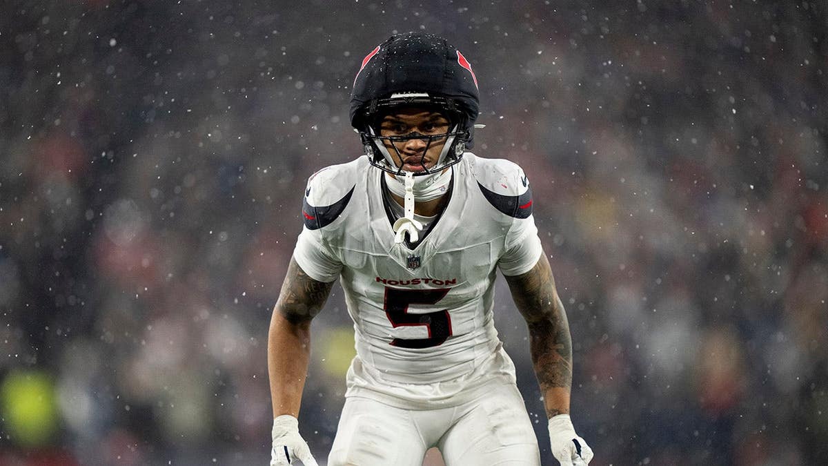 Jalen Pitre #5 of the Houston Texans lines up during a playoff game.