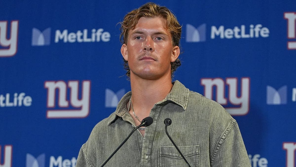 Jaxson Dart, New York Giants quarterback, listens to a question after a preseason game.