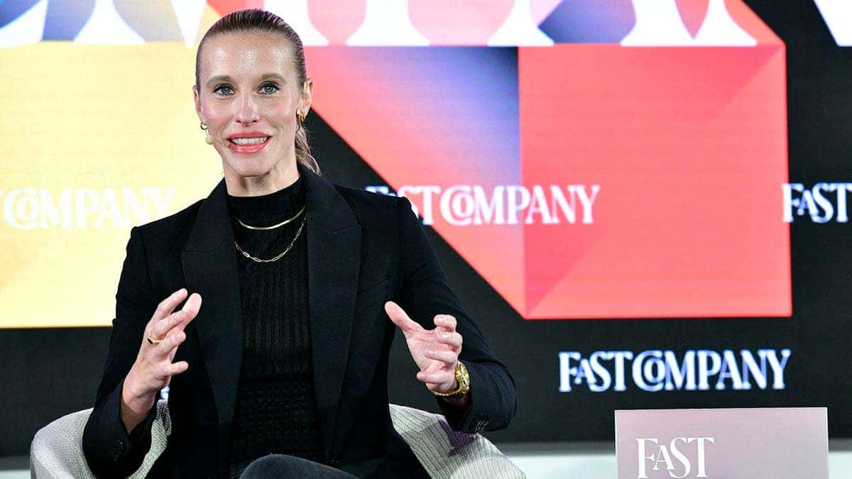Jessica Robertson, cofounder of Togethxr, speaks at a podium.