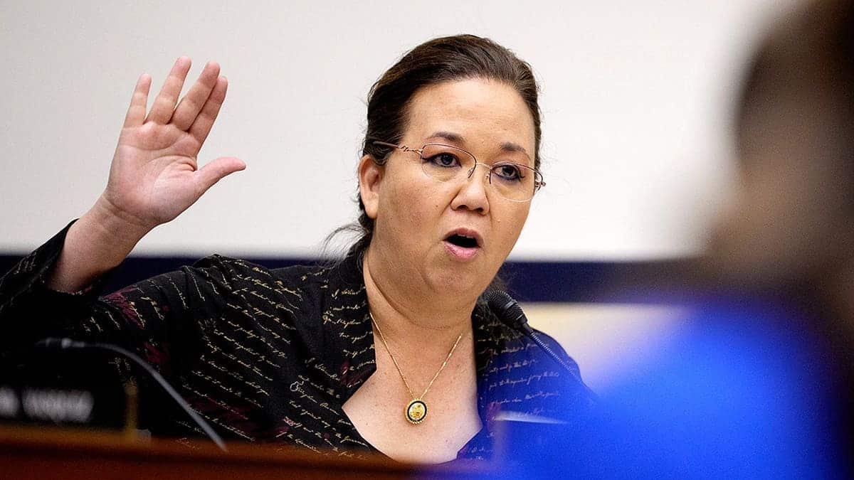 Picture of Jill Tokuda speaking with hand up