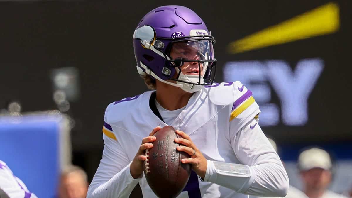 J.J. McCarthy, quarterback for the Minnesota Vikings, drops back to pass during a preseason game.