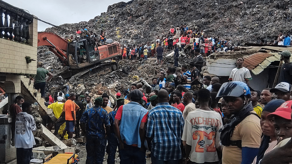 excavator on top of landfill