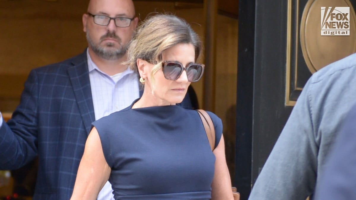 Paulette Thompson walking out of court