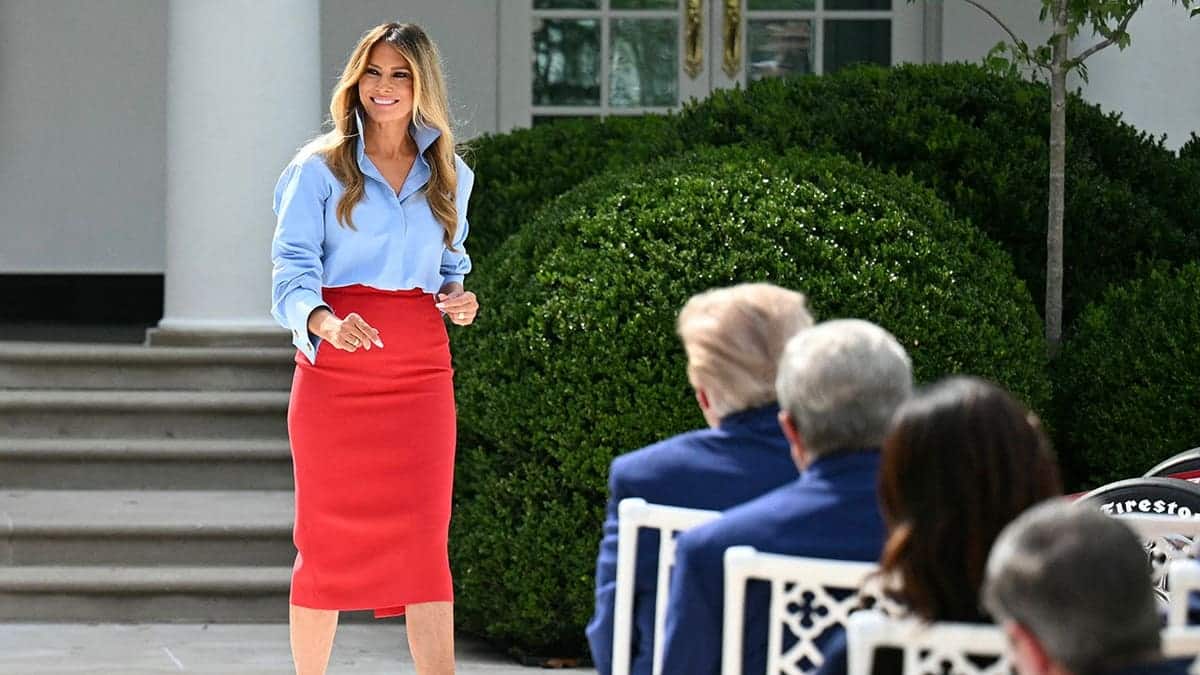 First Lady Melania Trump returns to her seat in the Rose Garden.
