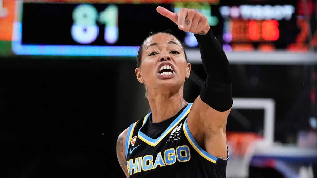 Natasha Cloud argues with Enes Kanter Freedom during a WNBA basketball game.