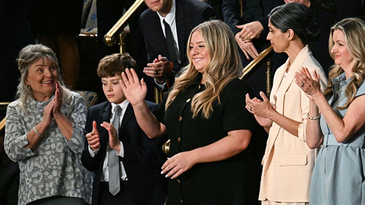 Payton McNabb, former high school athlete, stands as President Donald Trump speaks at the U.S. Capitol.