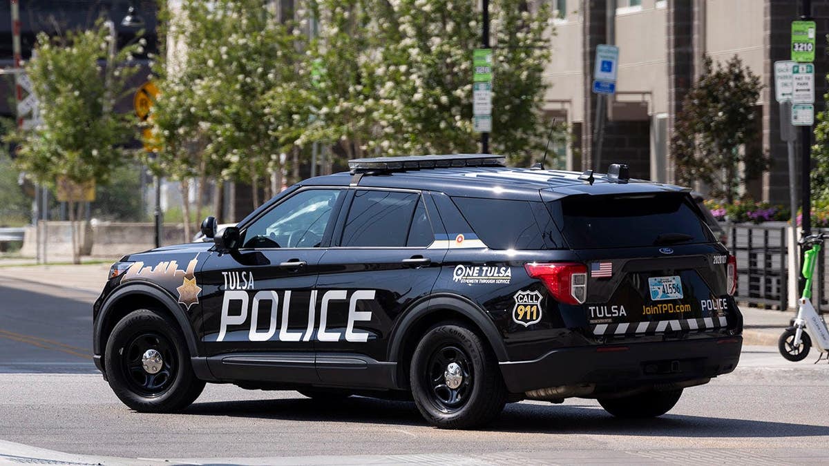 Police cruiser responds to an incident in Tulsa's Greenwood District, site of the 1921 Tulsa Race Massacre.