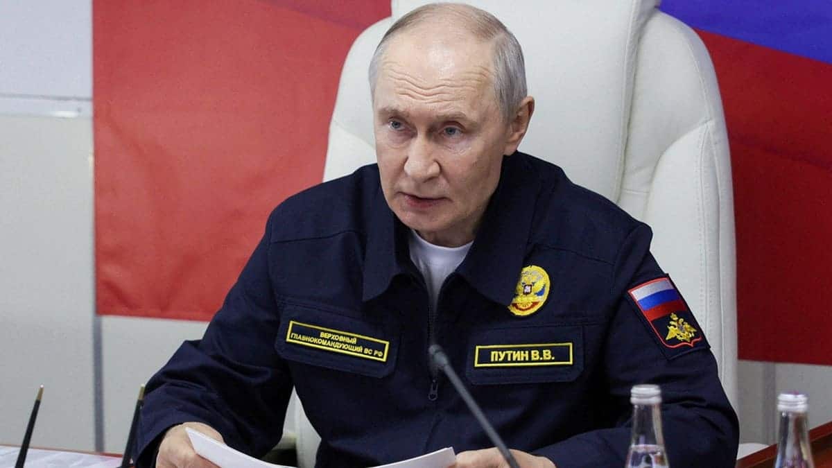 Vladimir Putin chairs a meeting aboard the missile cruiser Varyag.