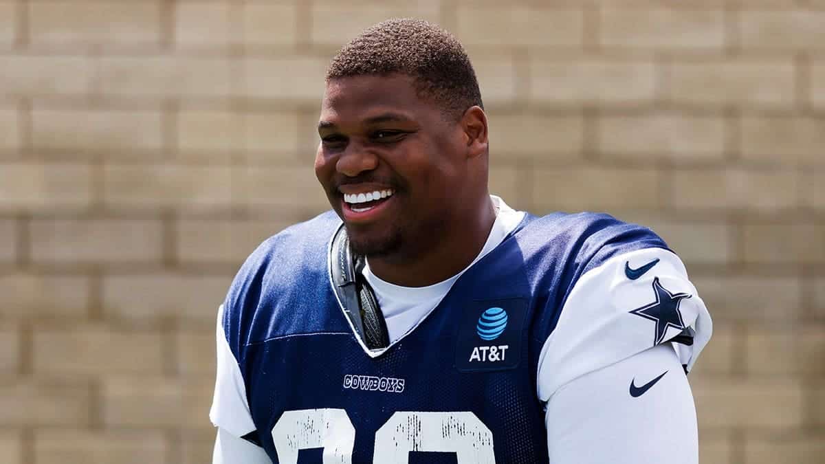 Quinnen Williams, Dallas Cowboys No. 92, smiles during training camp.
