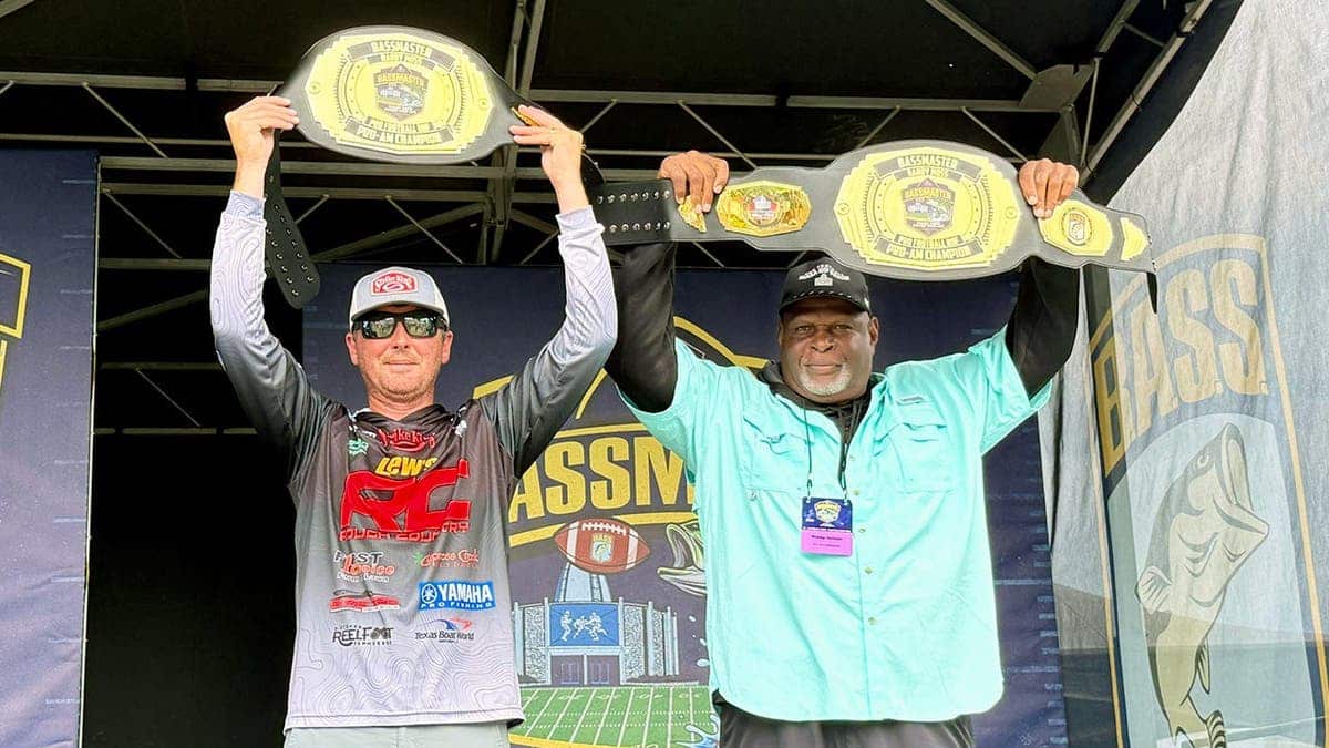 Rickey Jackson and John Garrett hold up their Pro-Am Championship belts.