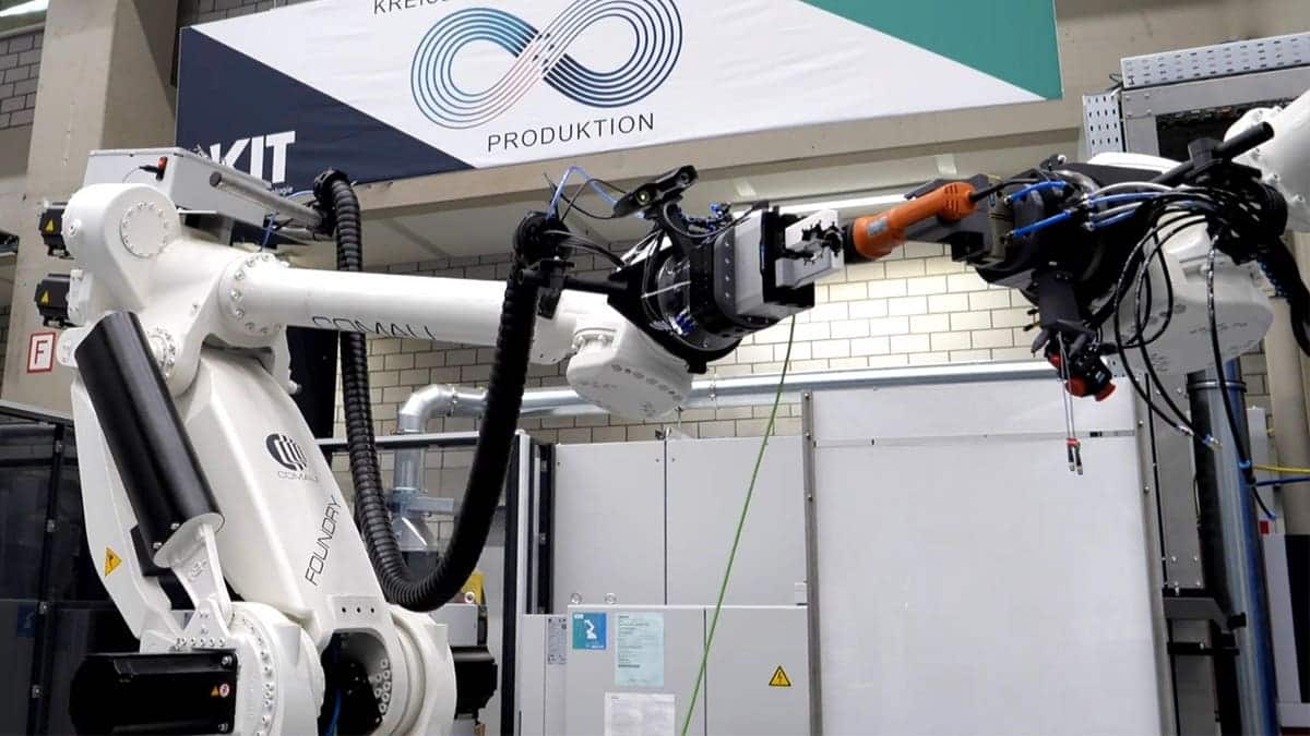 The robotic system is seen in a workshop.