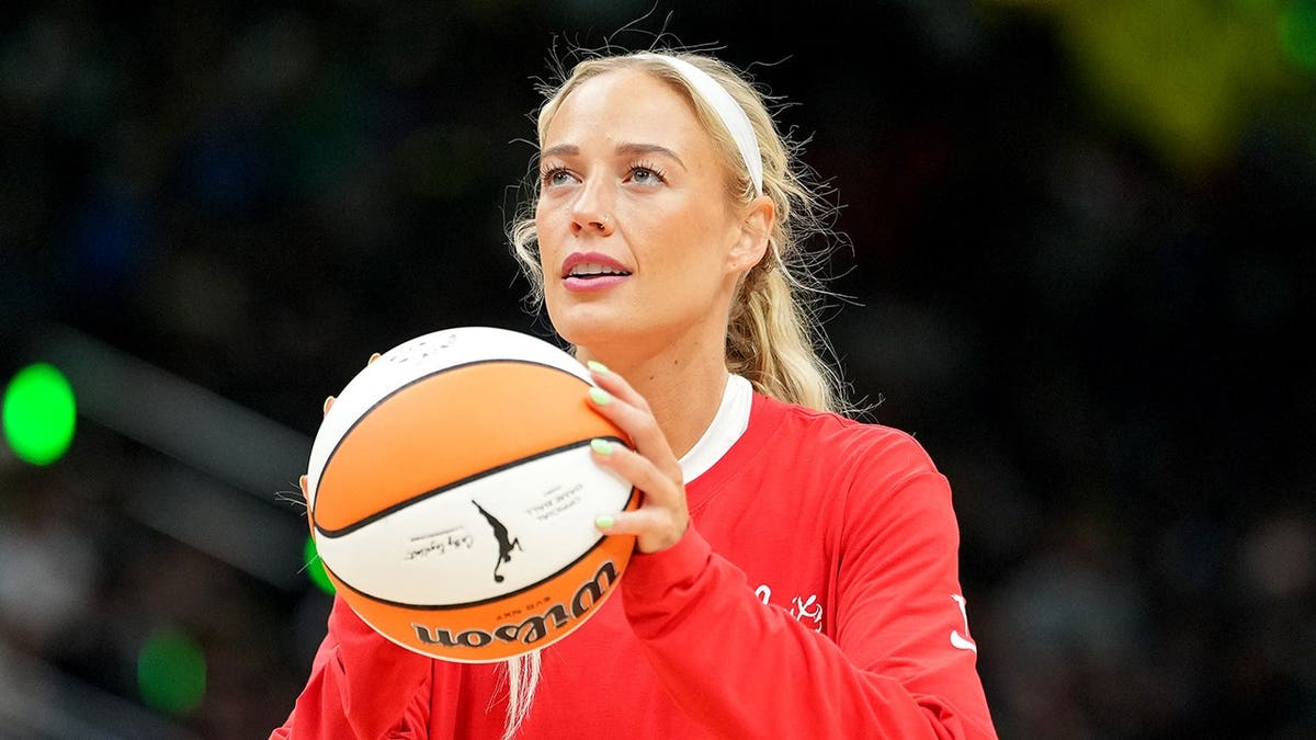 Sophie Cunningham warms up before a game at Climate Pledge Arena in Seattle.
