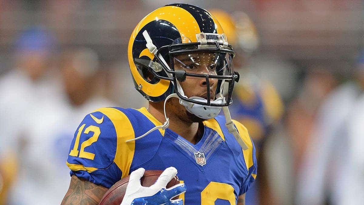 Stedman Bailey stands on the field in uniform before a game.