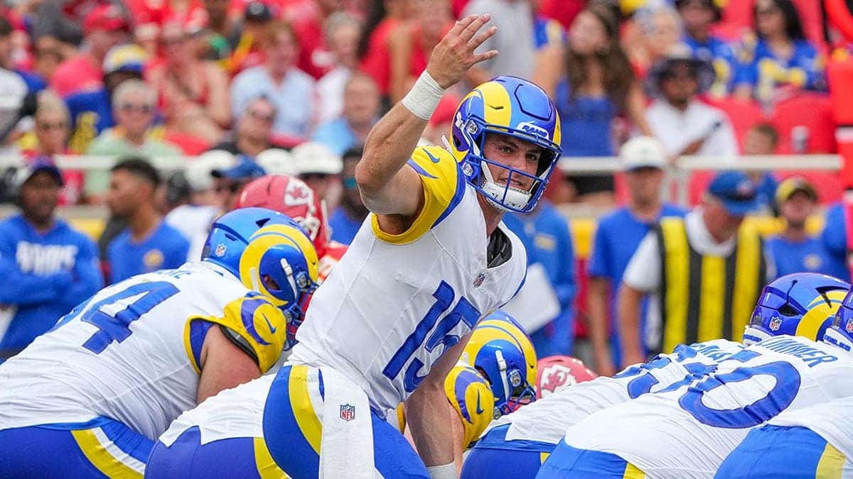 Ty Simpson signals at the line during a preseason game at Arrowhead Stadium.